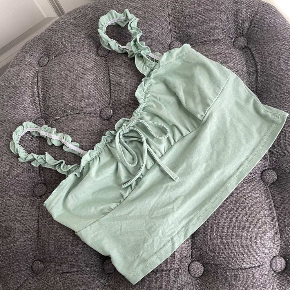 Not sure on the brand, size small, and light green.